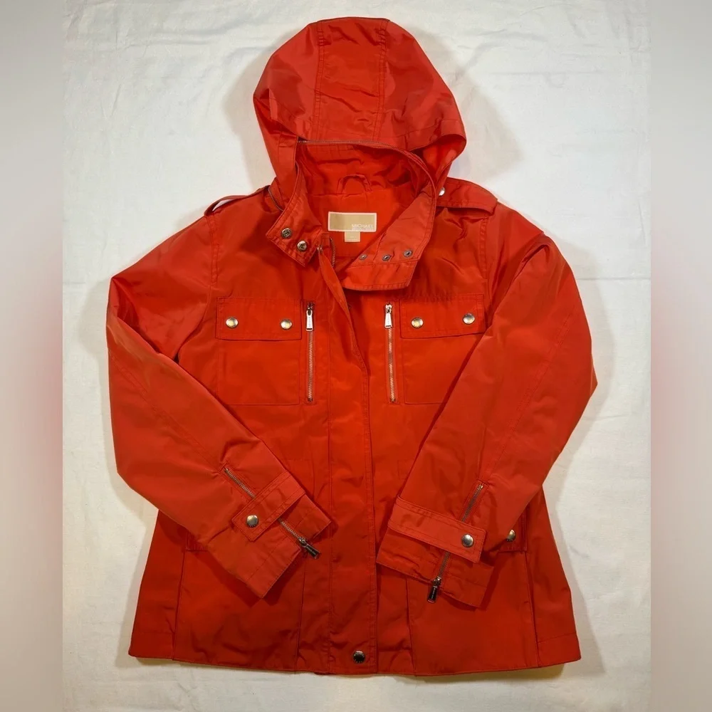 NWOT Michael Kor’s Women's Orange Hooded Rain Coat Jacket with silver details
